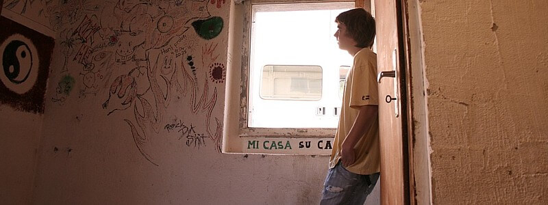 Young man in derelict room
