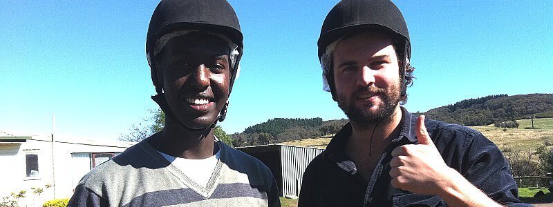 Two young men - thumbs up